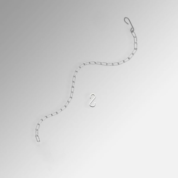 picture hanging in front of curtains or drapes with steel chain