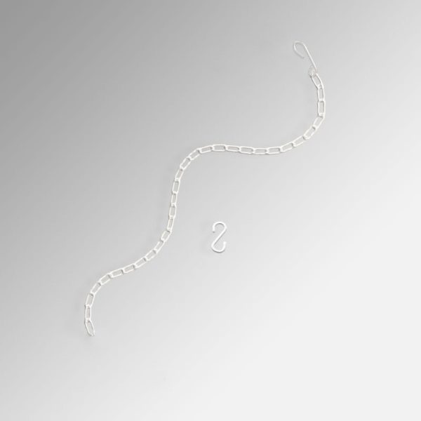 picture hanging in front of curtains or drapes with steel chain